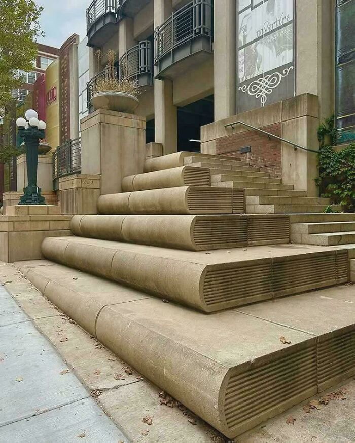 Concrete stairs designed to look like stacked books showcasing creative urban design improvements
