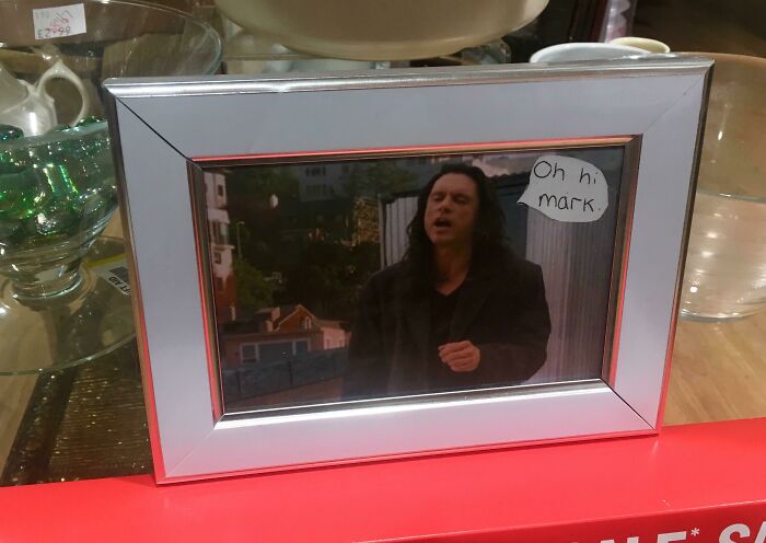 Framed photo with speech bubble saying oh hi mark from secondhand store