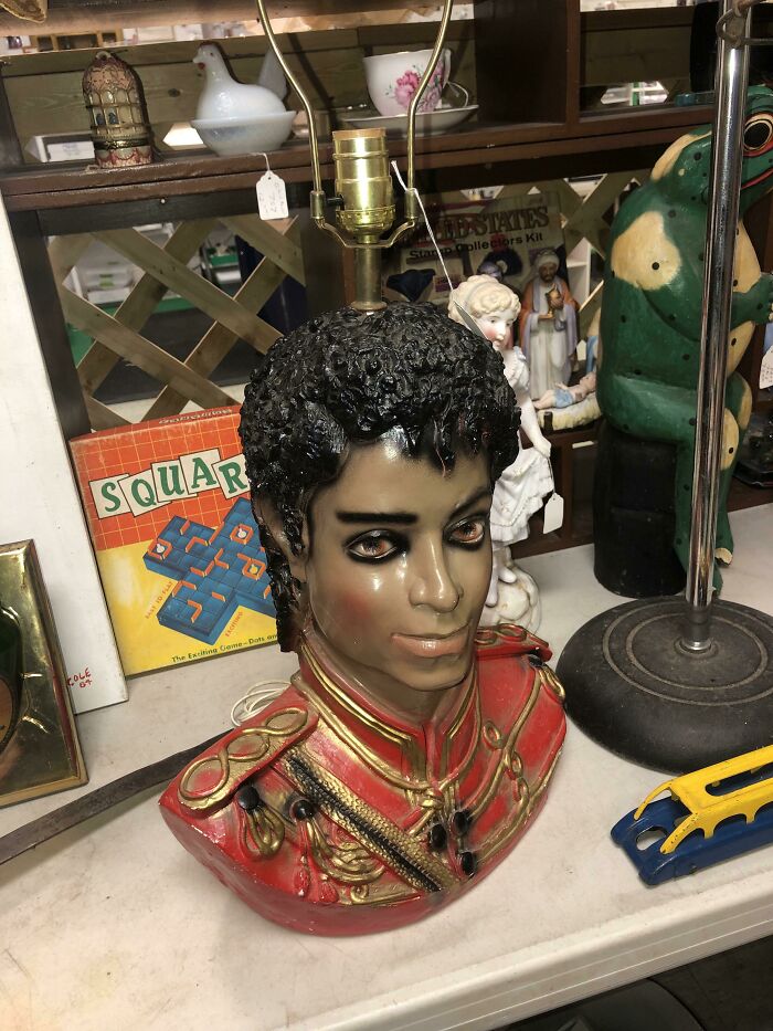 Absurd secondhand bust lamp with detailed military uniform and curly hair