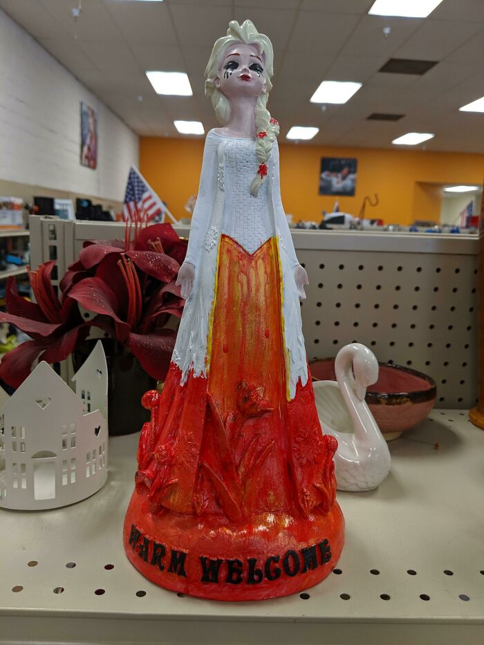 Absurd secondhand painted figurine with warm welcome text on base