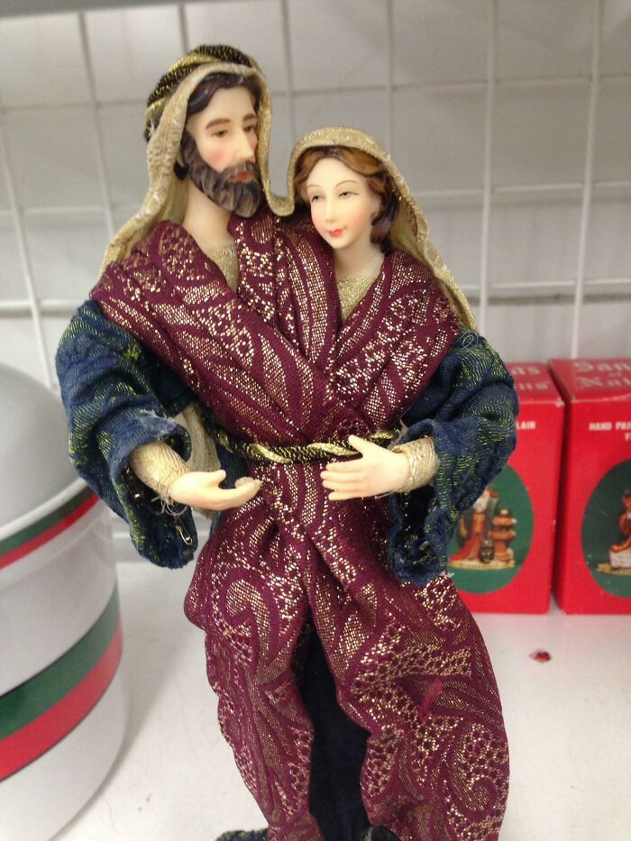 Decorative figurines of man and woman dressed in ornate robes
