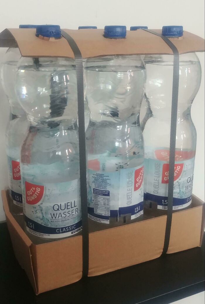 Water bottles packaged together with eco-friendly cardboard and straps