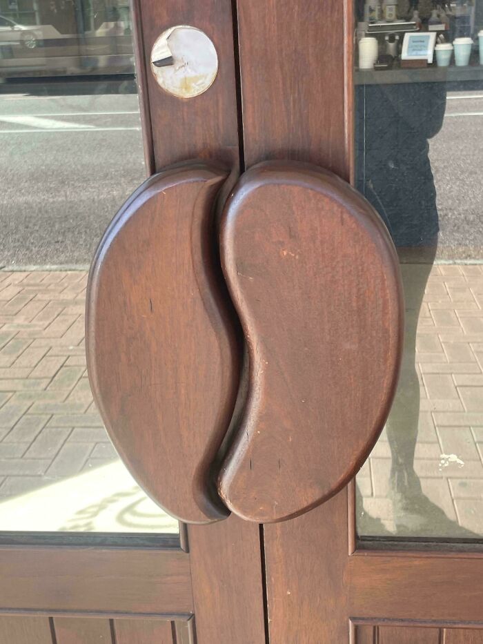 Wooden door handles shaped like beans adding creative design