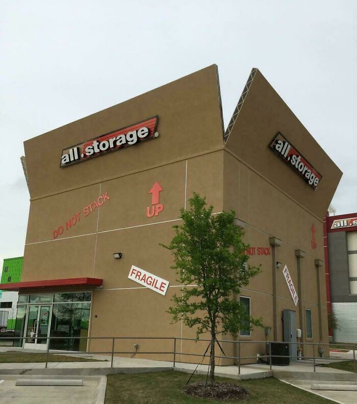 Building shaped like a large fragile cardboard box with storage signage