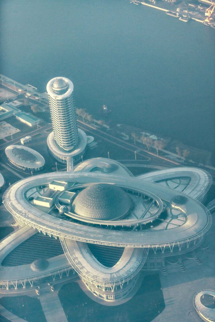 Futuristic architectural structure aerial view in urban hell cityscape