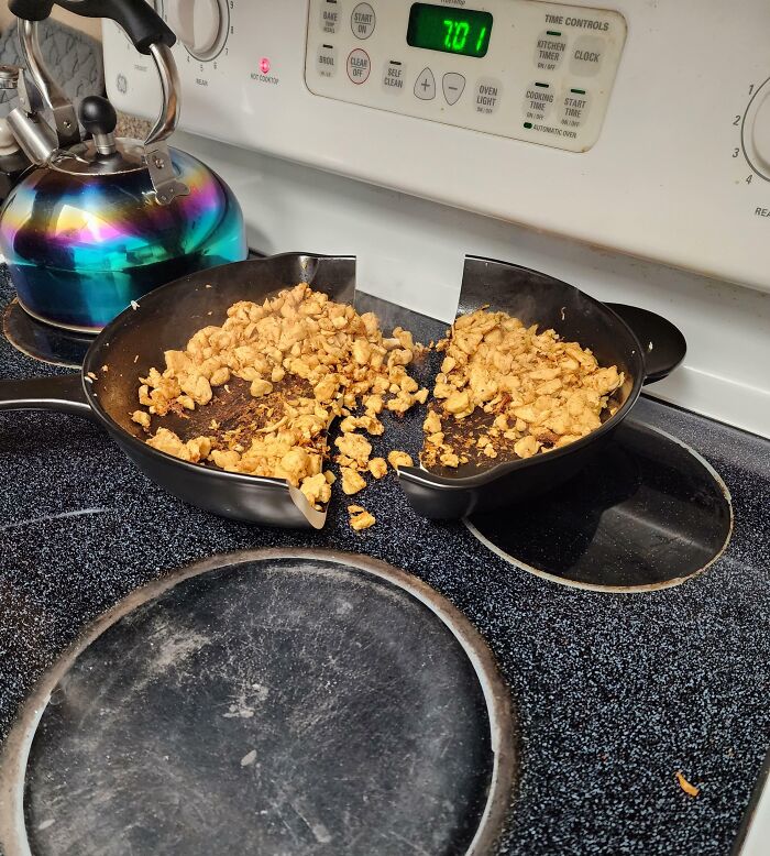 Cookware broken in half on stove with food spilled kitchen fail