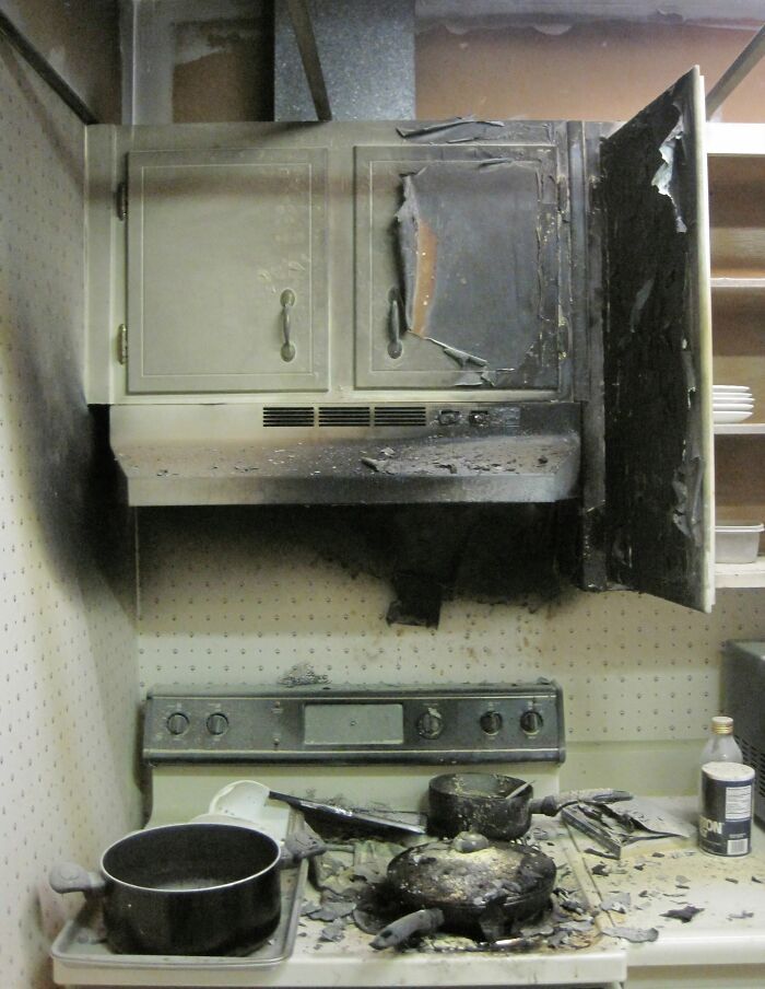 Kitchen stove and cabinets damaged by fire kitchen accident aftermath