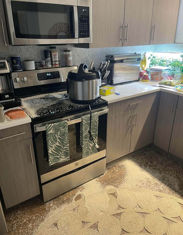 Rice spilled all over kitchen stovetop and floor from pressure cooker kitchen fail