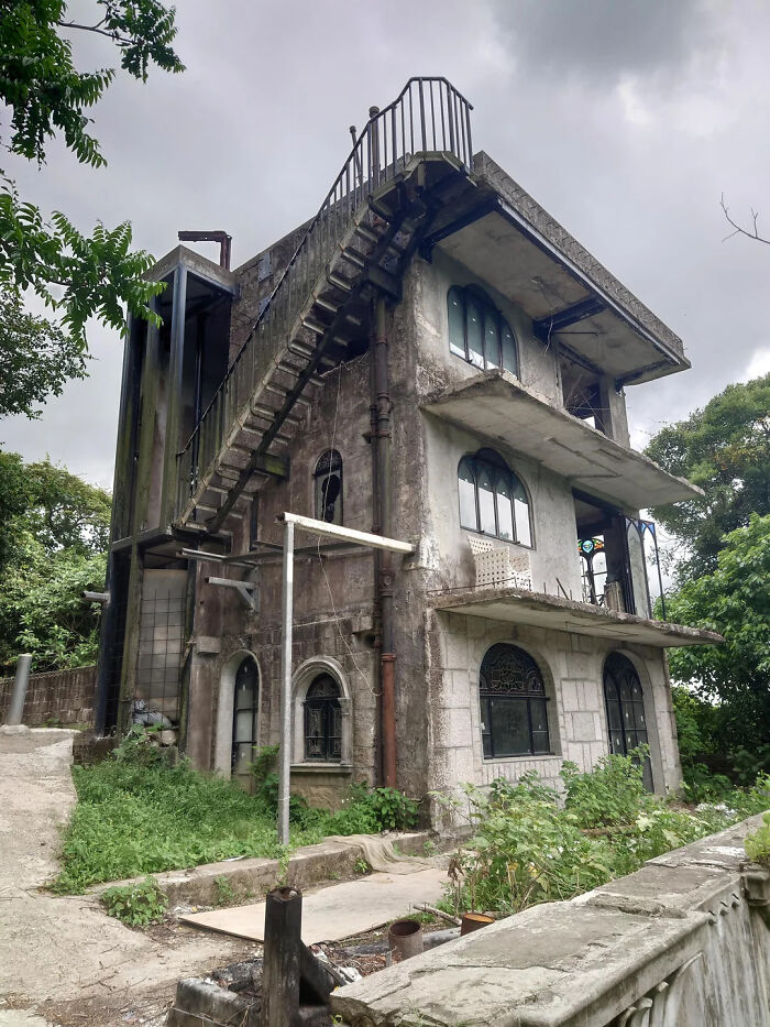 Abandoned dilapidated building in urban hell setting with eerie atmosphere