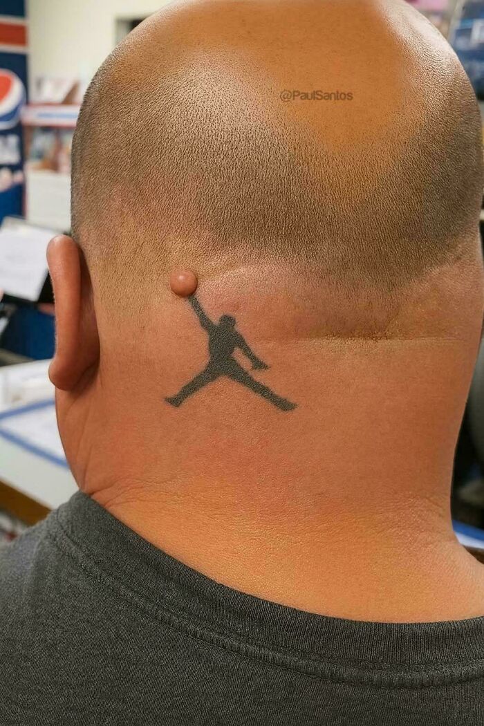 Unique tattoo with mole as basketball on person's neck hmm image