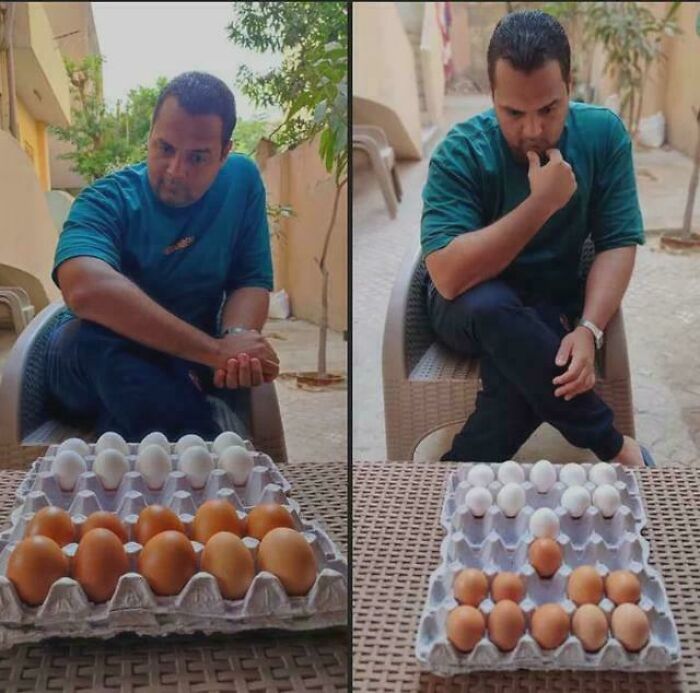 Man contemplating trays of white and brown eggs outdoors