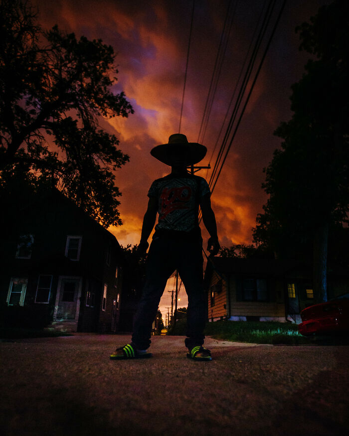 Took This Photo Of A Neighbor Kid As A Giant Storm Was Passing The Other Night