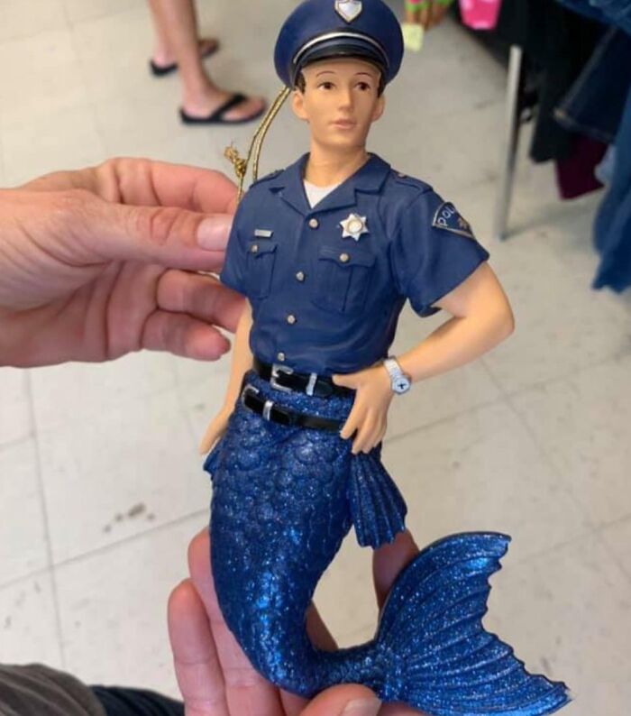 Figurine combining police officer uniform with mermaid tail secondhand find