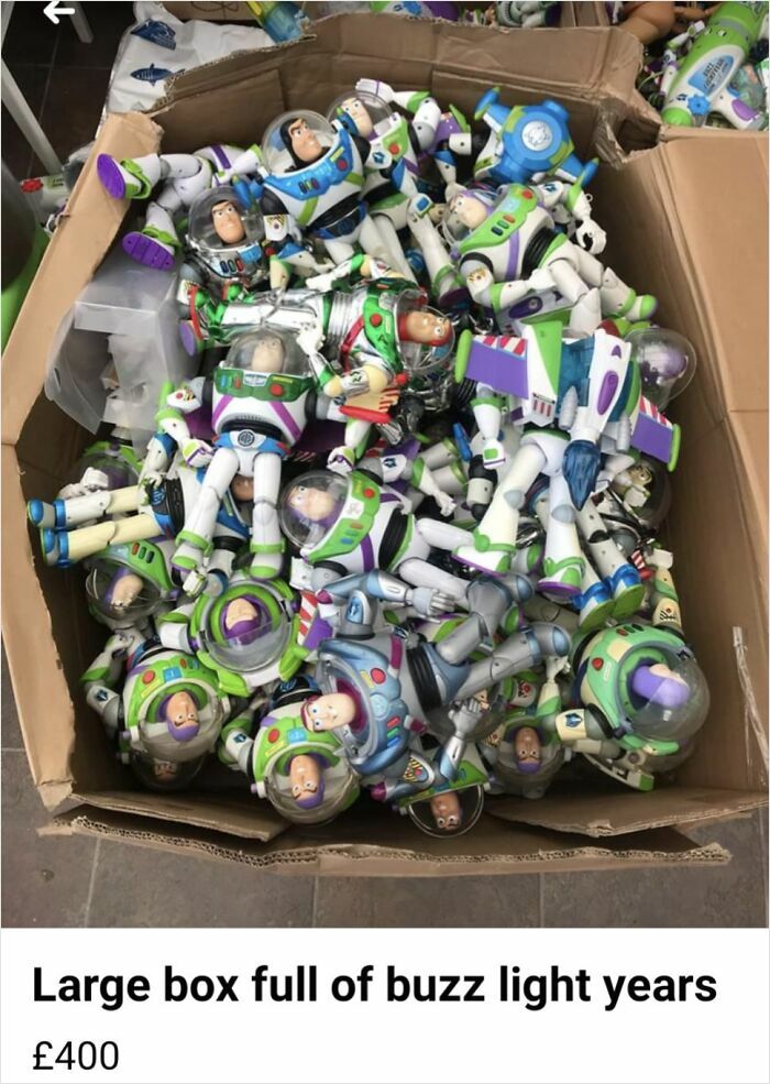Box filled with numerous Buzz Lightyear action figures for sale