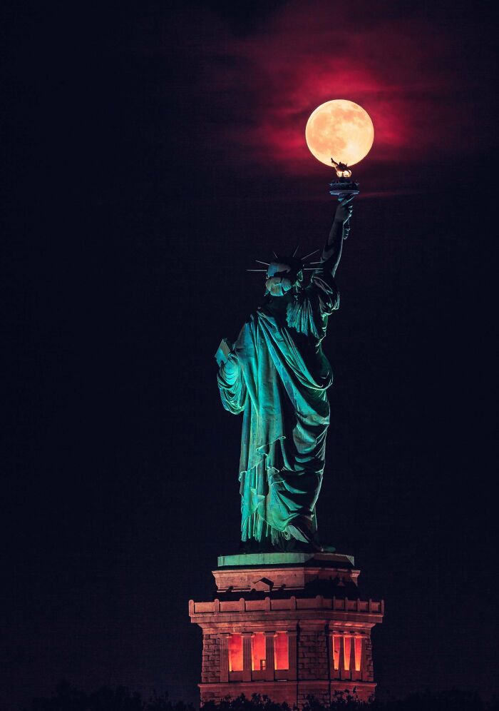Last Night's Rare Summer Solstice Full Moon Balancing On The Statue Of Liberty's Torch