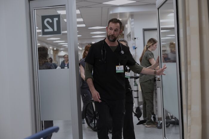 Scene from The Pitt showing Noah Wyle as a doctor in hospital hallway Scene from The Pitt showing Noah Wyle as a doctor in hospital hallway