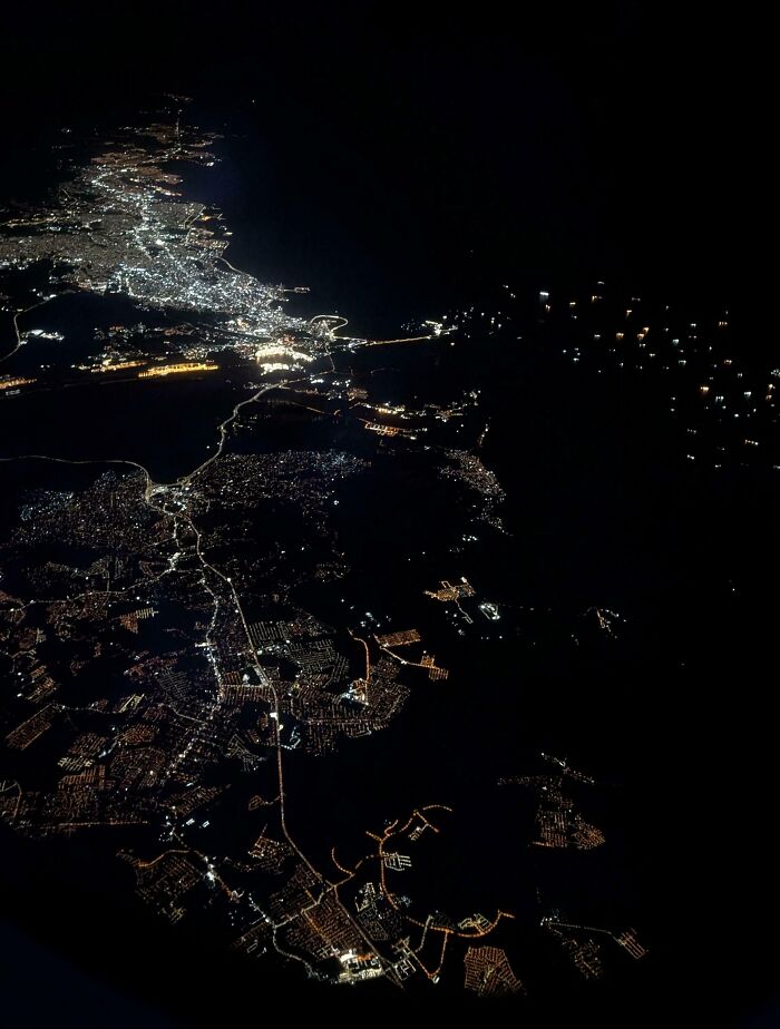 Panama Canal At Night, The Lights On The Sea Are Boats Waiting For Their Turn To Go Through