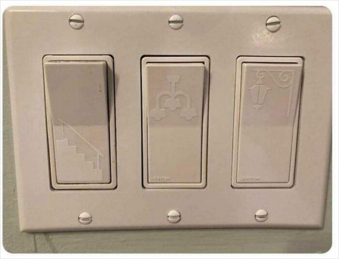 Light switches with icons for stairs, faucet, and lamp for easy identification