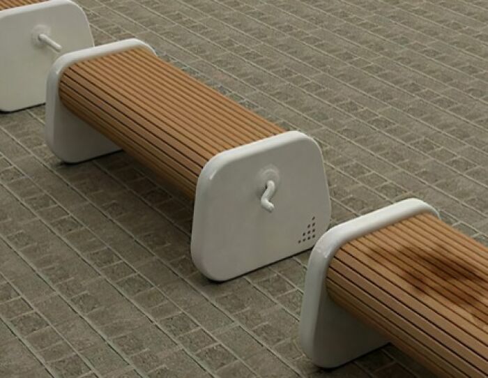 Bench with built-in hand crank for interactive public seating