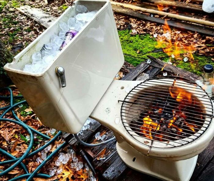 Low-tech solution using a toilet as a fire pit and cooler with ice and drinks
