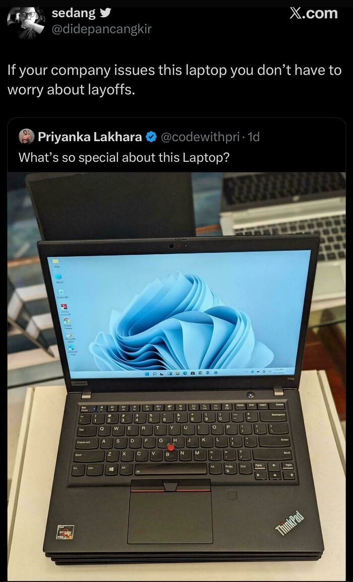 Tweet about a Lenovo ThinkPad laptop with comment on job security and layoff
