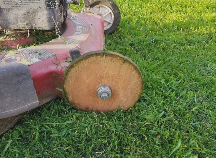 Lawn mower with wooden wheel replacement hack
