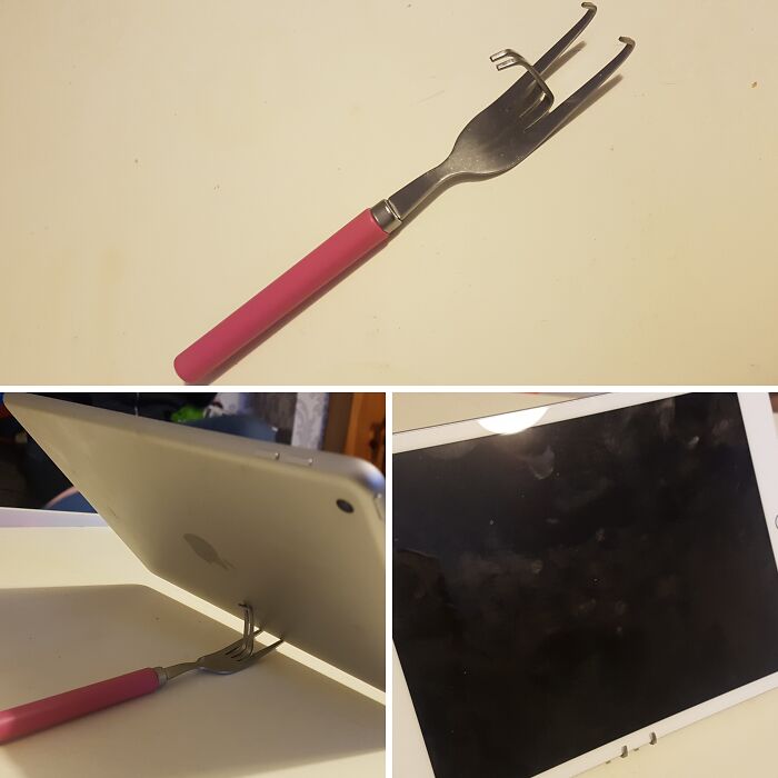Low-tech tablet stand made from a fork with handle on a table