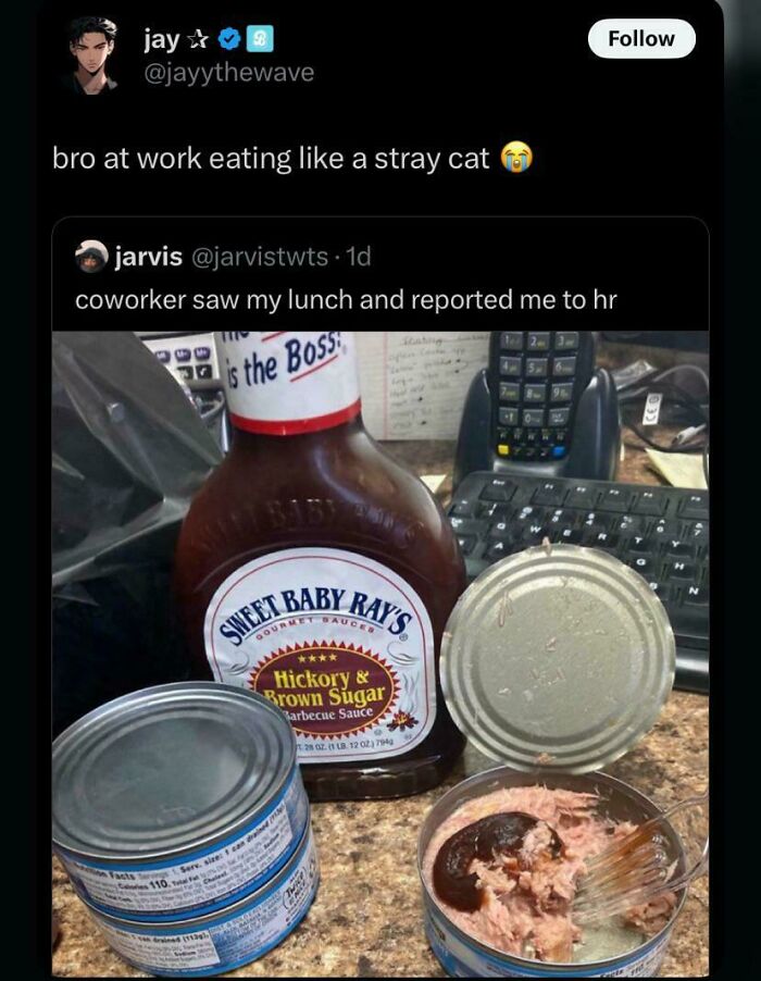Lunch with canned tuna and barbecue sauce on office desk shown as disgusting dish