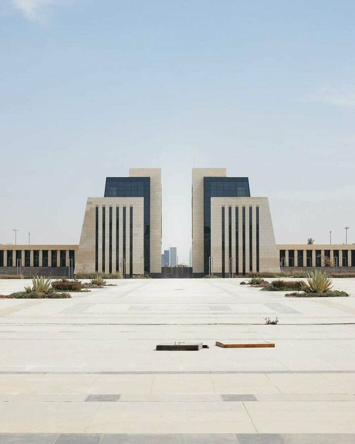 Modern minimalistic urban hell building with symmetrical design and empty plaza