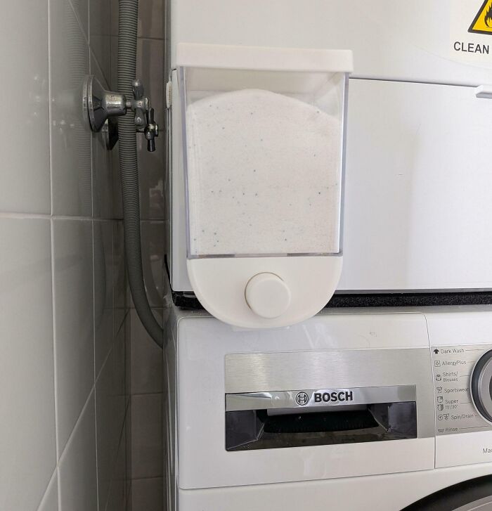 Mounted laundry detergent dispenser attached above washing machine