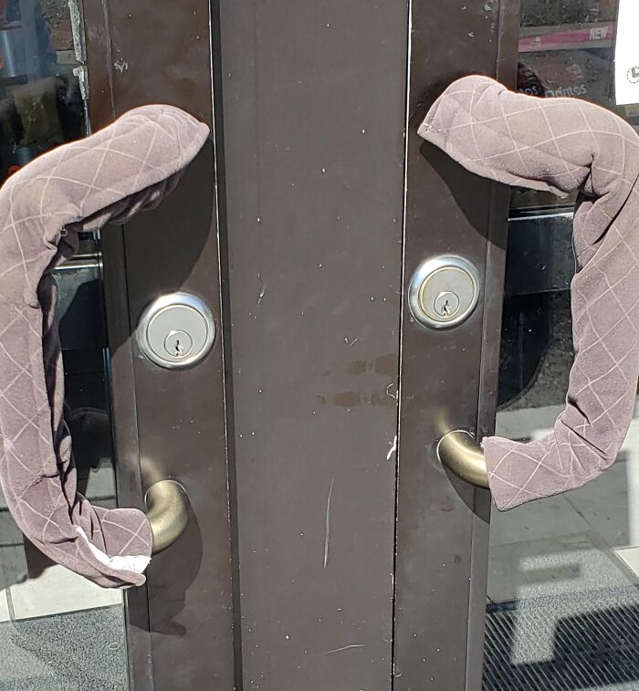 Creative oven mitt covers on door handles for added protection and grip