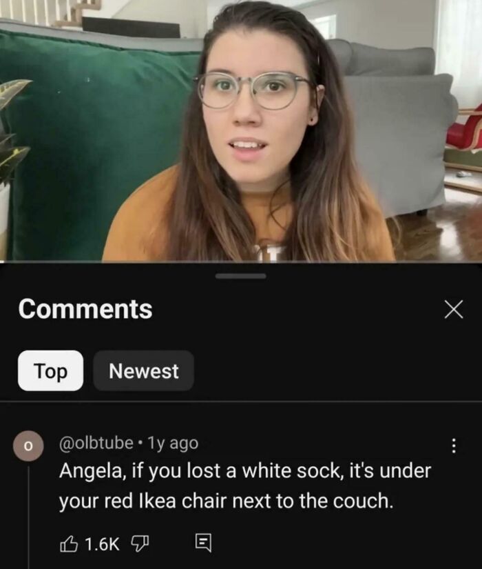 Woman reading humorous comment about a lost sock under Ikea chair