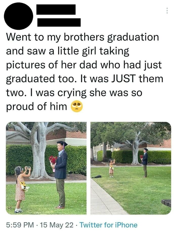 Father and daughter at graduation with daughter taking pictures showing pride