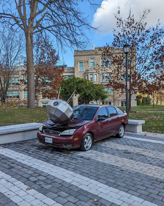 Car with antenna sculpture crashed on campus parking area