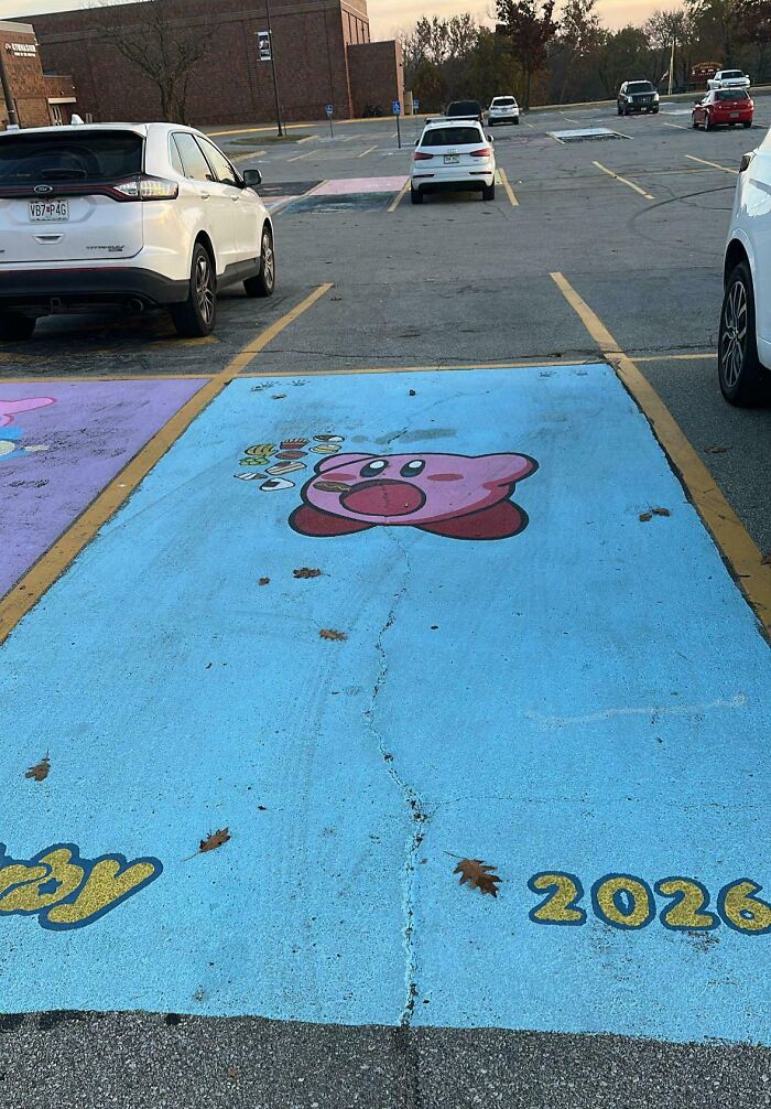 Kirby themed school parking spot painted blue with 2026 graduation year