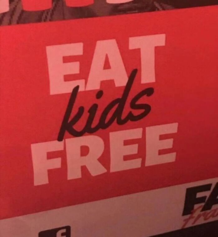 Sign with confusing text eat kids free in restaurant promotion