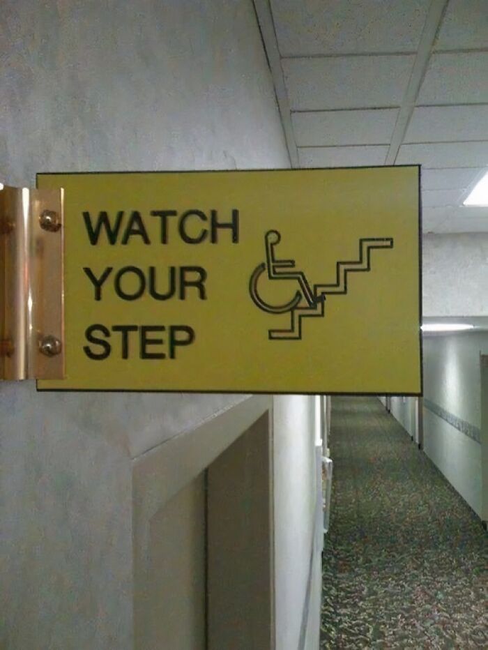 Absurd sign warning wheelchair users to watch their step on stairs