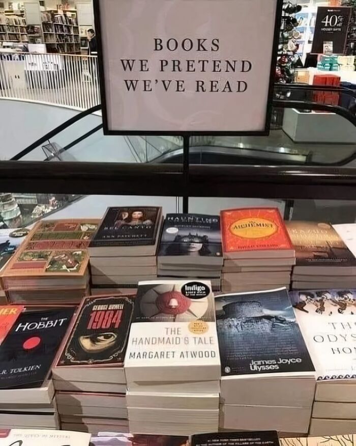 Funny bookstore sign labeling books as ones we pretend we've read