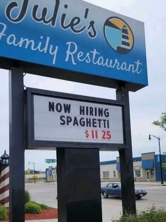 Sign for Julie's Family Restaurant humorously hiring spaghetti at $11.25