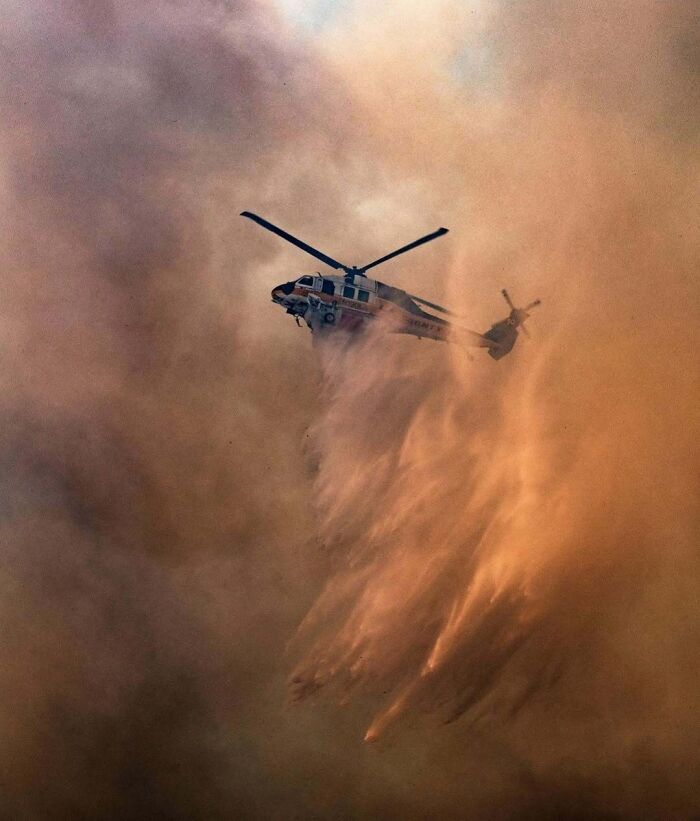Firehawk (AKA Copter 19) Drops Water Through The Thick Smoke As The Elsmere Fire Burns Through An Oil Field