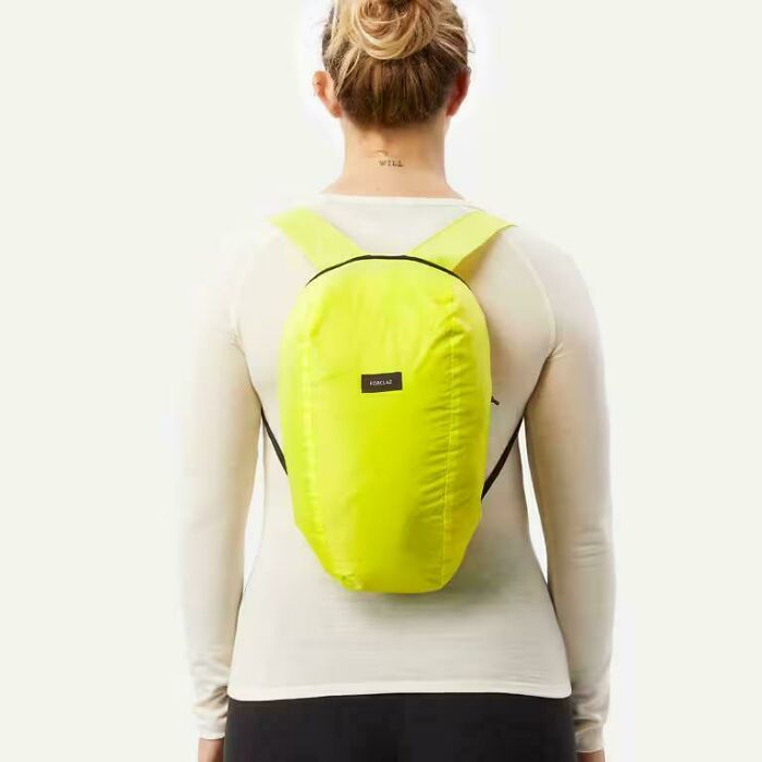 A person from the back wearing a bright yellow backpack, representing posts about work and recruiting.