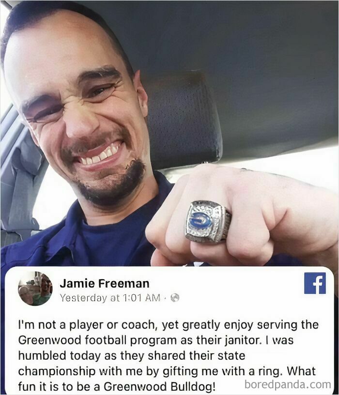 Janitor proudly showing off Greenwood football championship ring