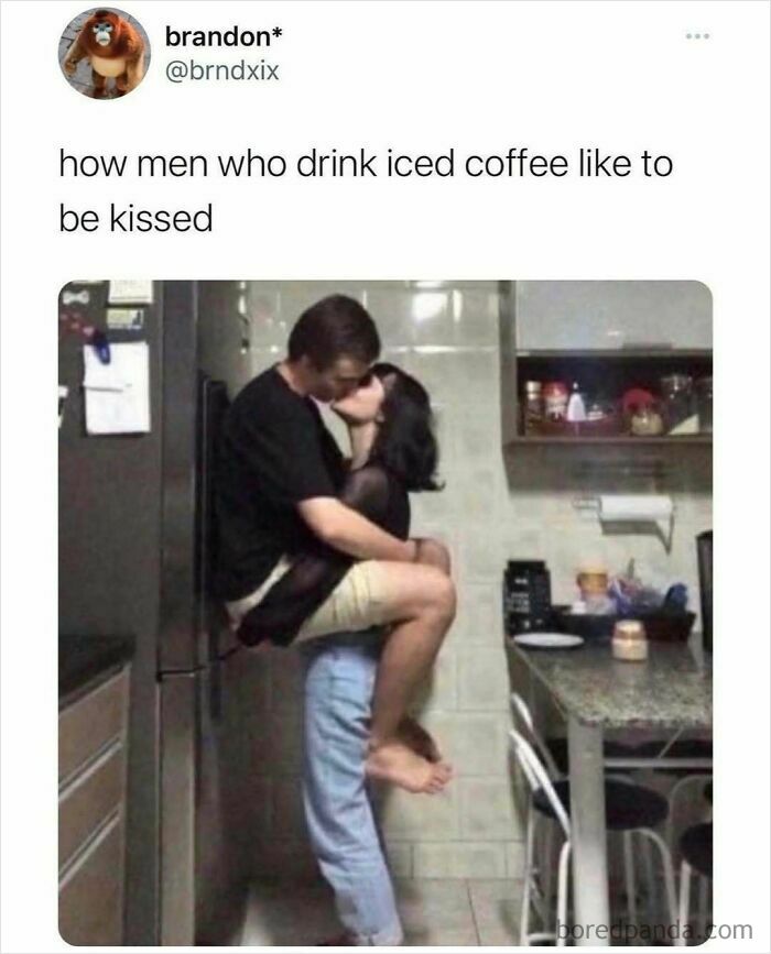 Couple kissing in kitchen illustrating men who drink iced coffee in random meme