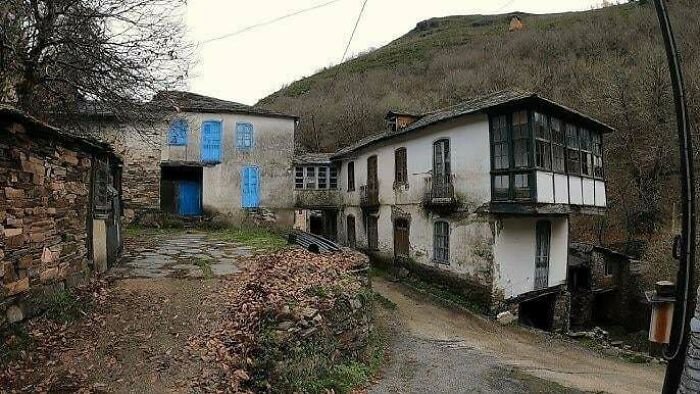 Old abandoned village representing urban hell with worn houses and barren surroundings
