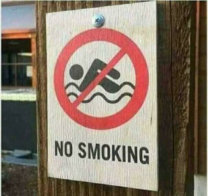 A Funny 'You Had One Job' Fail: A sign with a no swimming icon, but the text beneath says NO SMOKING, an obvious fail.