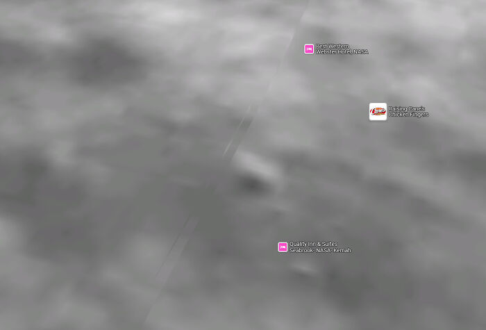 Blurry satellite image showing NASA area with Google Maps shenanigans icons