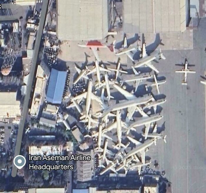 Aerial view of numerous parked planes at Iran Aseman Airline Headquarters on Google Maps