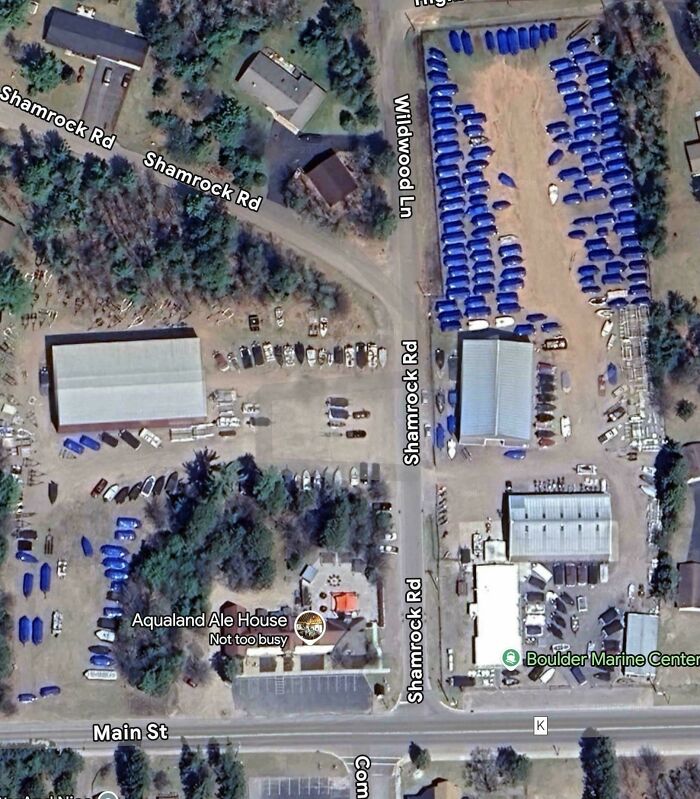 Google Maps satellite view showing Shamrock Rd parking area with multiple vehicles