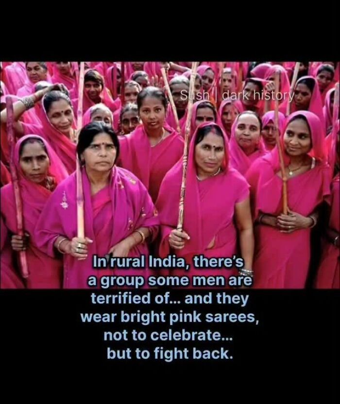 Group of women in bright pink sarees fighting back in rural India history