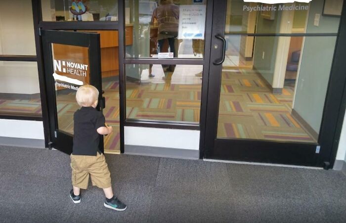 Child using a low-height door designed for easy access between rooms